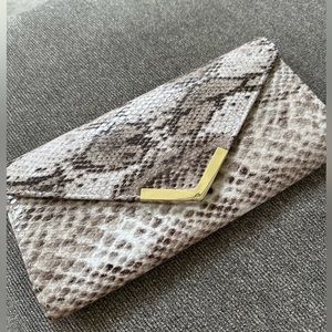 Snake skin print clutch